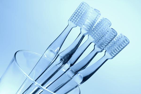 A toothbrush with toothpaste, ready for a nighttime brush